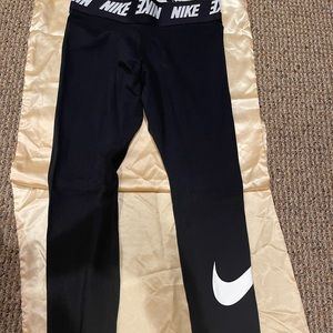 Nike leggings with swoosh on one leg